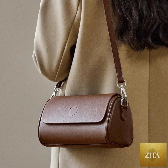 Elegant genuine leather mini round handbag tote for women, shoulder bag with a stylish design by Social Buzz eSIMs.