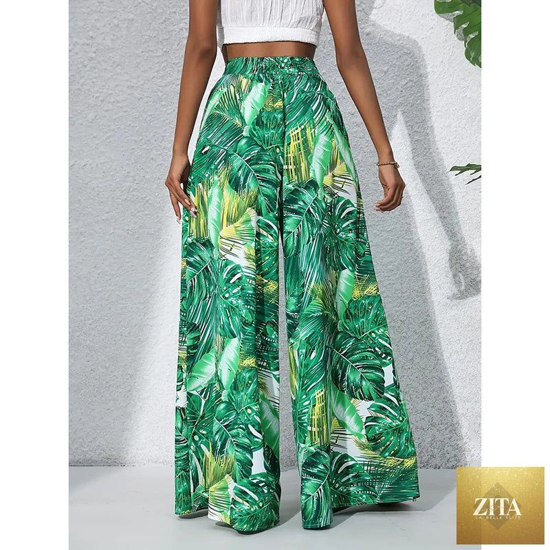 Women’s printed high-waist wide-leg palazzo pants by FitiqueFit, featuring a casualwear style with colorful floral print.