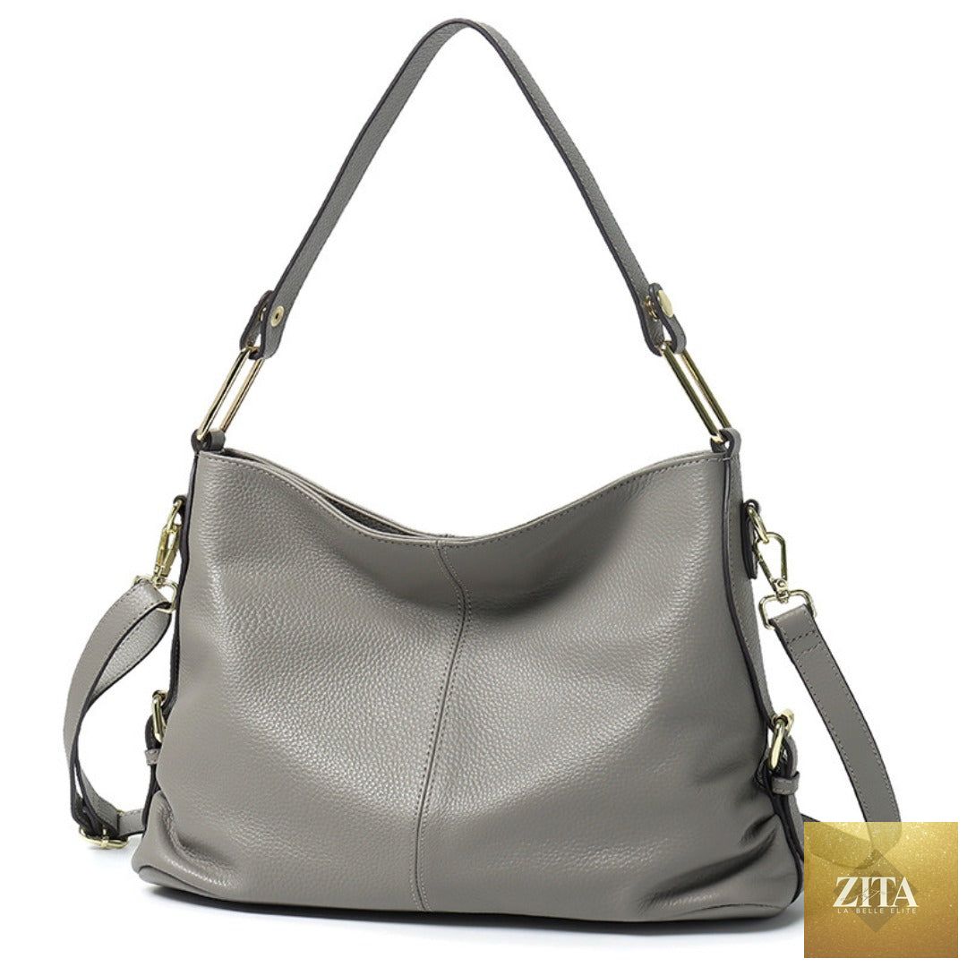 Elegant genuine leather handbag by SHOMICOBOUTIQUE featuring a stylish hobo and crossbody tote design with polished hardware.