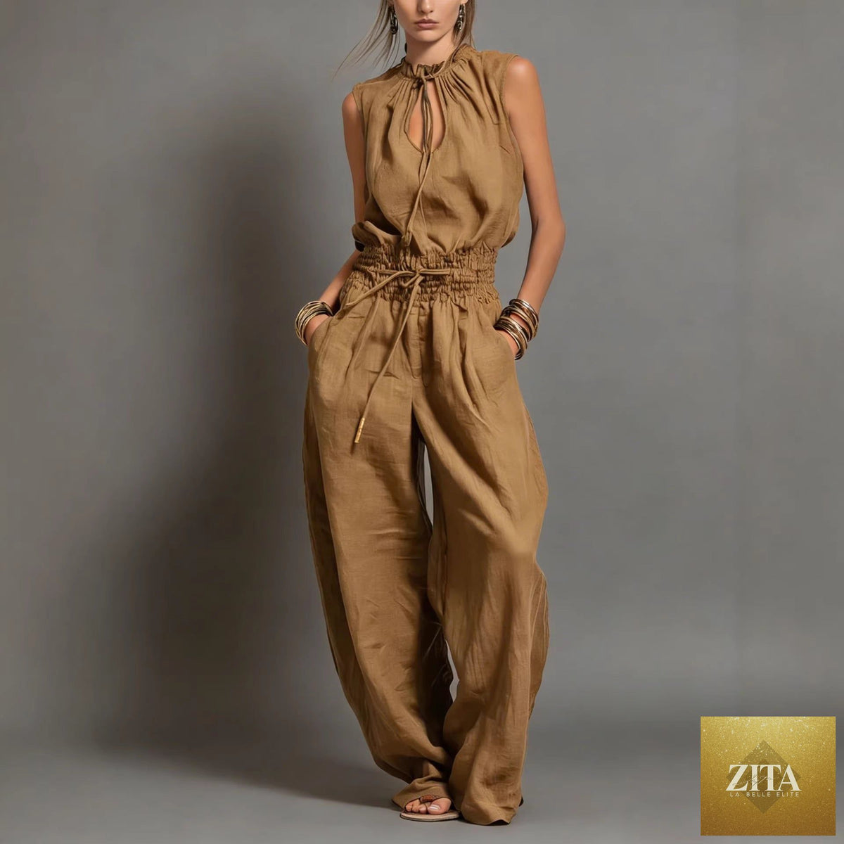 Women's sleeveless high-waist wide-leg pleated jumpsuit by FitiqueFit, shown in a casualwear style with a relaxed fit.