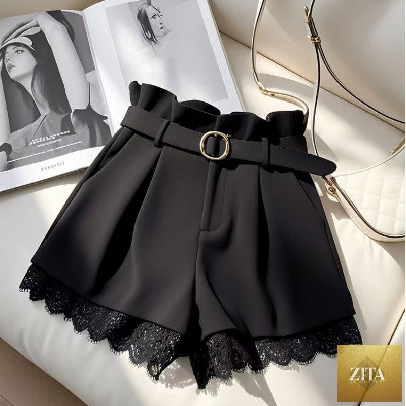 High-waisted casual shorts for petite women, cropped length, in neutral fabric, styled with a relaxed fit and belt loops.
