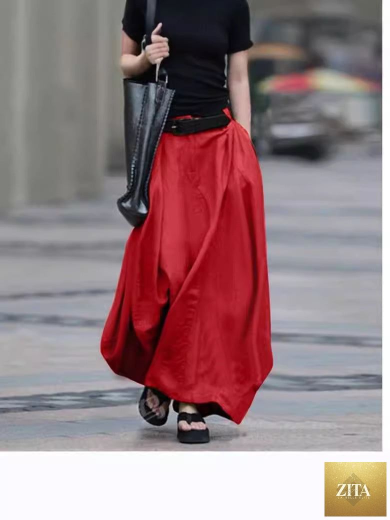 Women's high-waist flared maxi skirt by FitiqueFit in solid cotton linen with pockets, flowing design, and ankle-length silhouette.