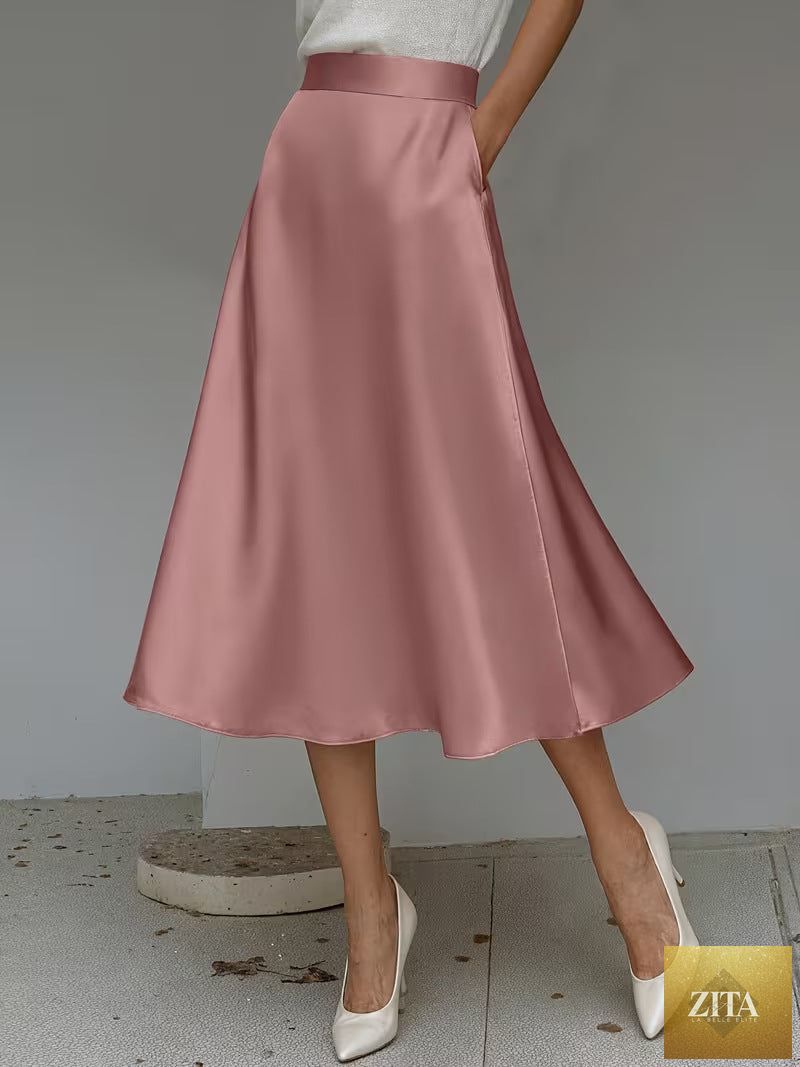Women's satin solid color mid-length skirt by Zita La Belle Elite, featuring a smooth fabric and slight stretch for a comfortable fit.