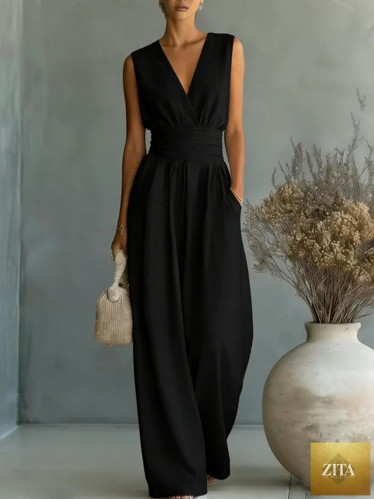 Women's elegant V-neck sleeveless jumpsuit by Zita La Belle Elite, featuring a waist-cinching fit and straight-leg design.