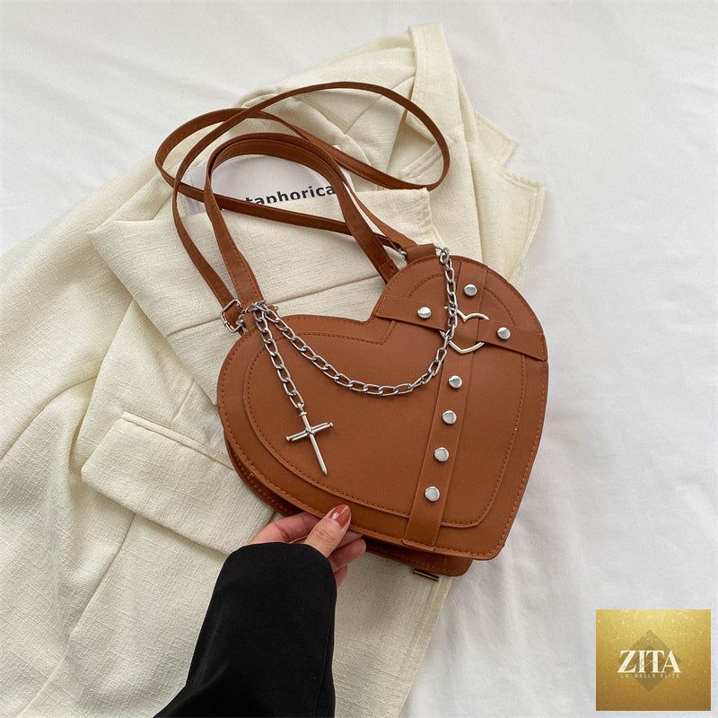 Korean-style cute heart-shaped shoulder crossbody bag with niche design, featuring vibrant colors and a compact, stylish look.