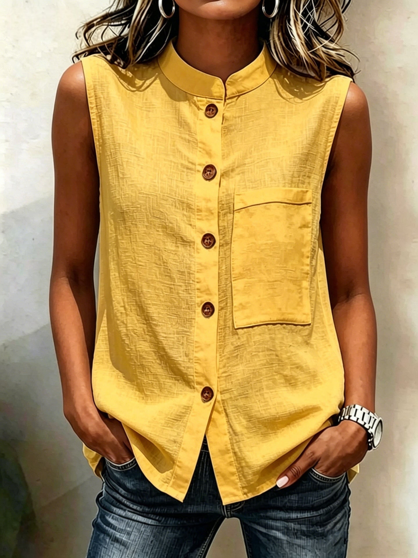 Women's sleeveless crop top by FitiqueFit with buttoned pockets, solid color, casualwear style, shown in water background.