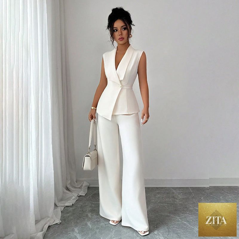Women's peplum sleeveless blazer and wide-leg pants two-piece set by MERIDGE, displayed on a mannequin.