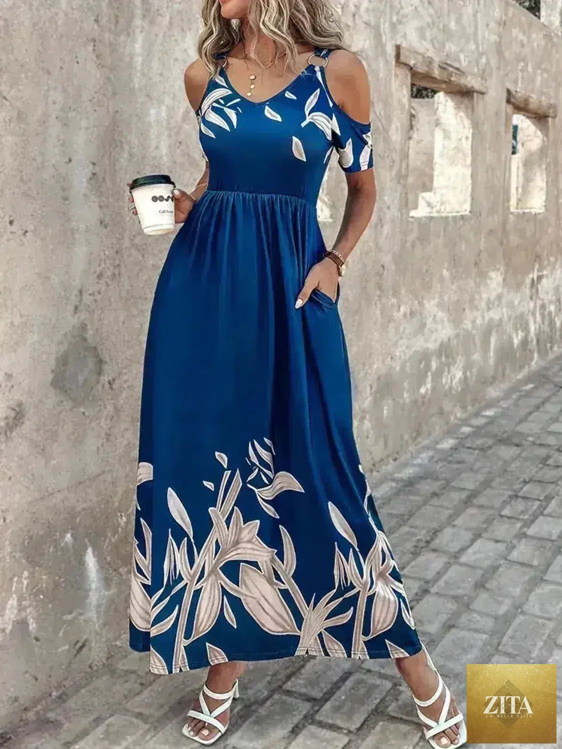 Printed cold shoulder maxi dress for women by Femstylo, stylish polyester dress with a flowing silhouette and floral pattern.