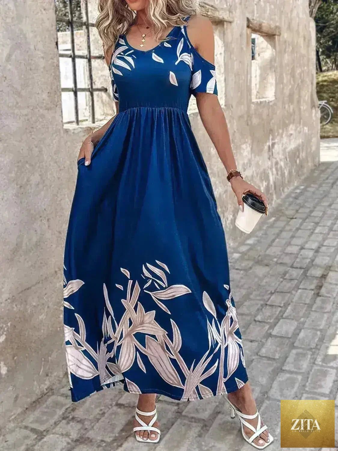 Printed cold shoulder maxi dress for women by Femstylo featuring stylish polyester fabric and a flattering, flowy design.