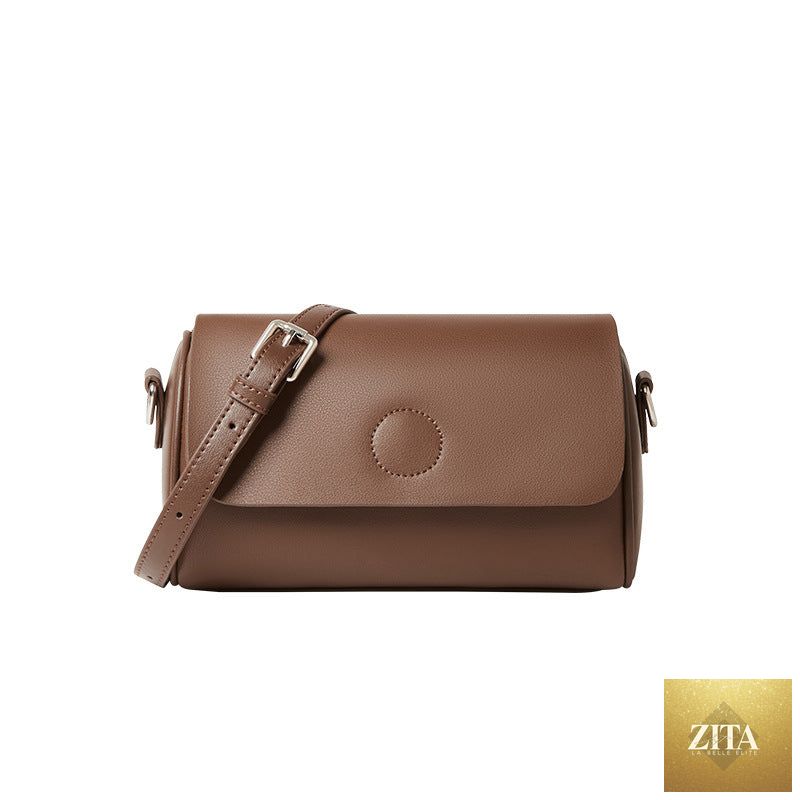 Elegant genuine leather mini round handbag tote for women with shoulder strap, stylish and compact for everyday use.