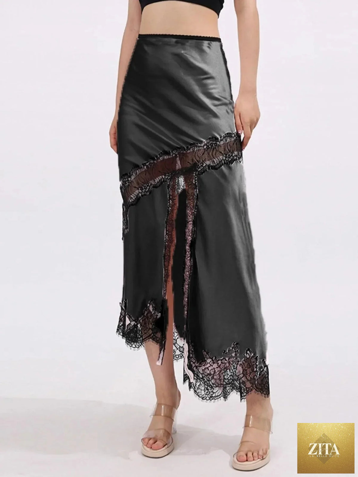 Zita La Belle Elite lace trim asymmetrical midi skirt with flowy fabric and detailed lace accents, shown from the side.