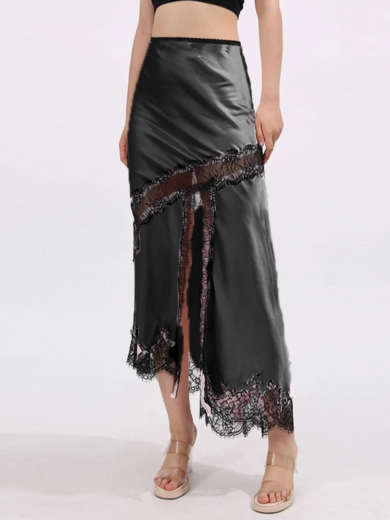 Lace trim asymmetrical midi skirt from The Fashion Celestial with flowing fabric and stylish design, shown in natural lighting.