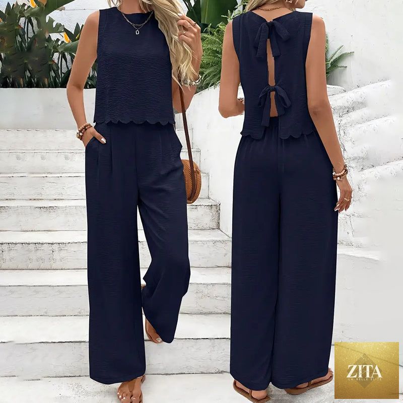 FitiqueFit elegant 2-piece matching casualwear set with sleeveless crop top and wide-leg pants, styled for a modern look.