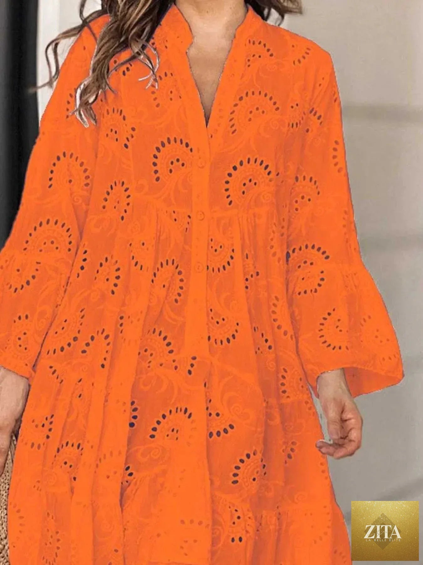 Eyelet ruffled hem tiered dress by Shopiebay, featuring a flowy design with layered tiers and delicate eyelet detailing.