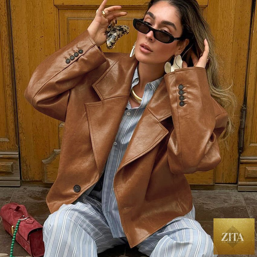 Women’s PU leather jacket with suit collar, stylish coat from Zita La Belle Elite, featuring a sleek, fitted design.