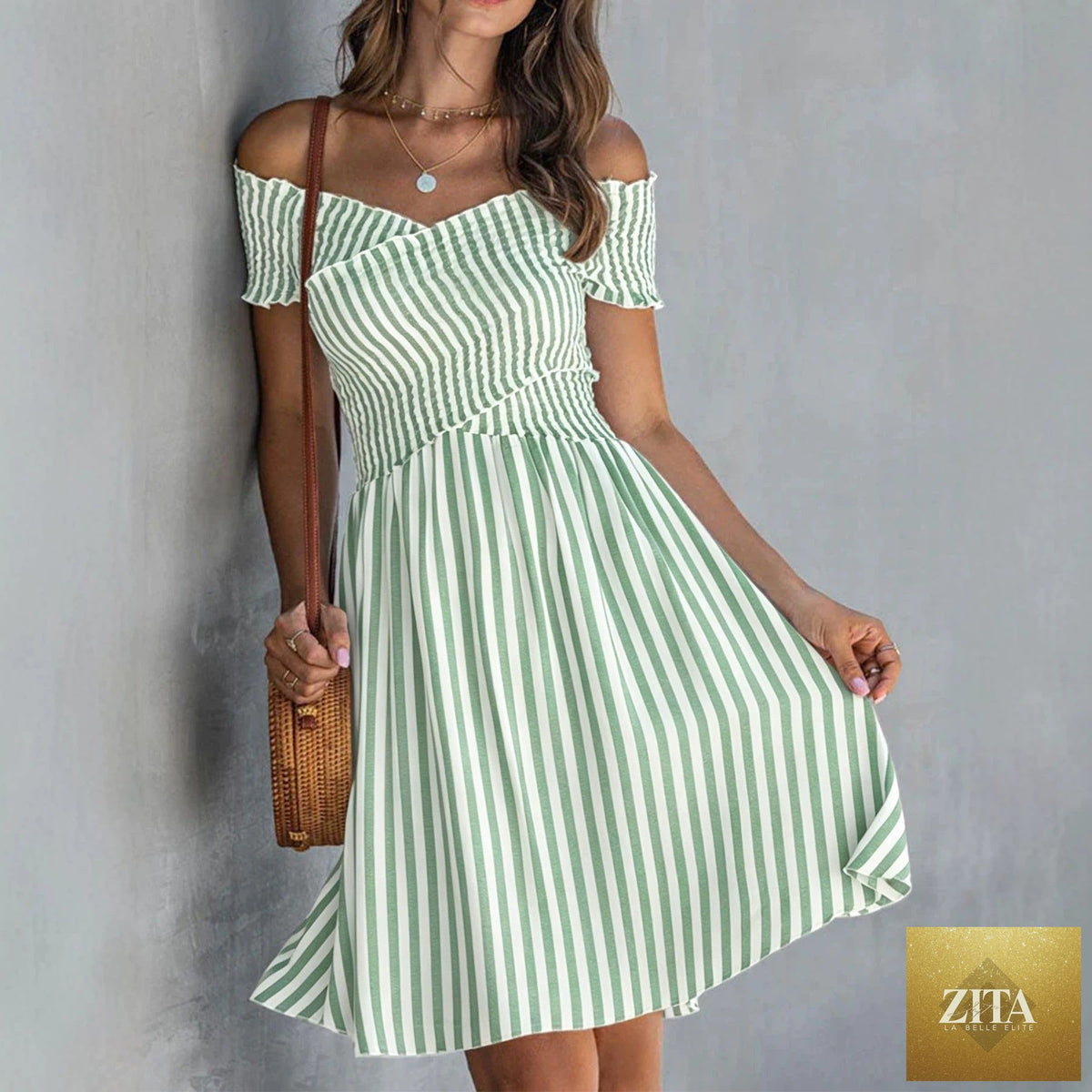 Women's off-shoulder striped waist-cinching midi dress by Zita La Belle Elite, showcasing a casualwear style with a fitted waist and bold stripes.