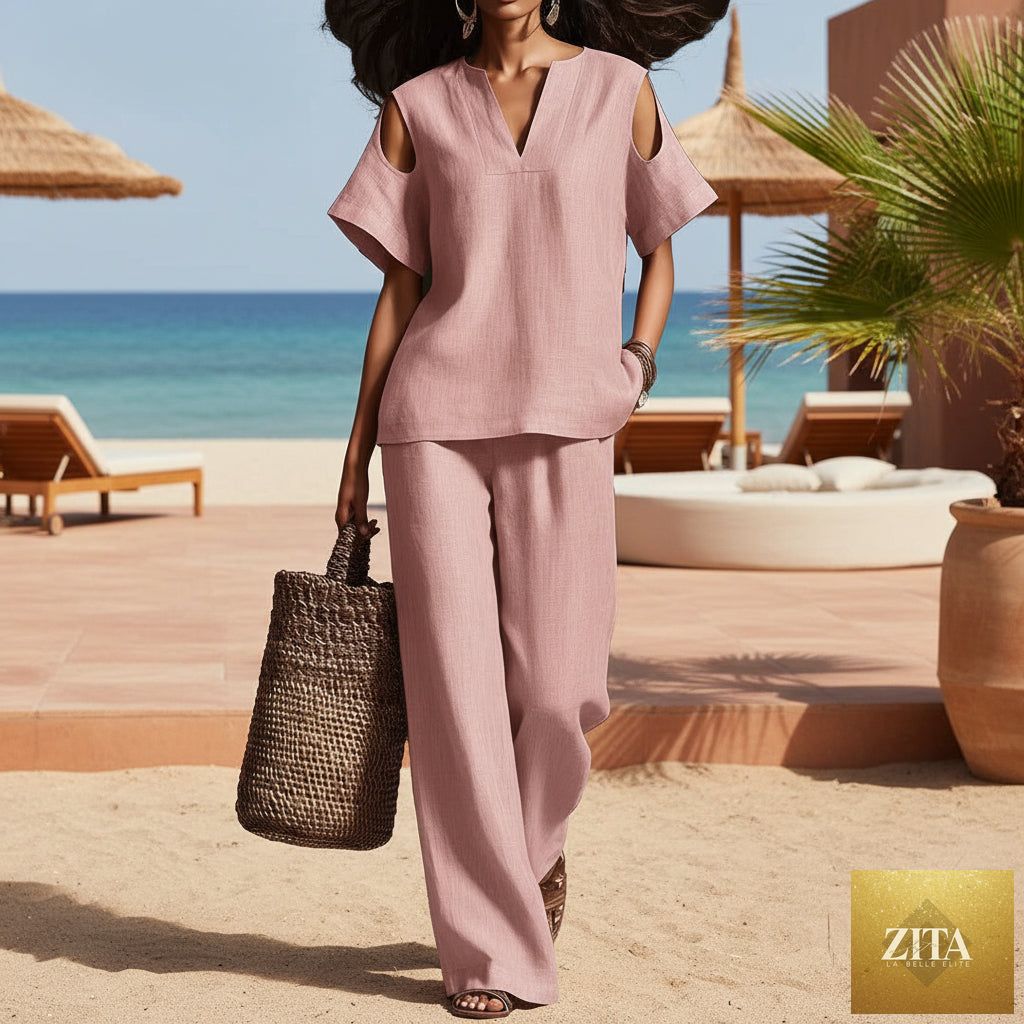 Zita La Belle Elite two-piece V-neck short sleeve top and straight-leg pants set with ripped detail and pockets in solid color.