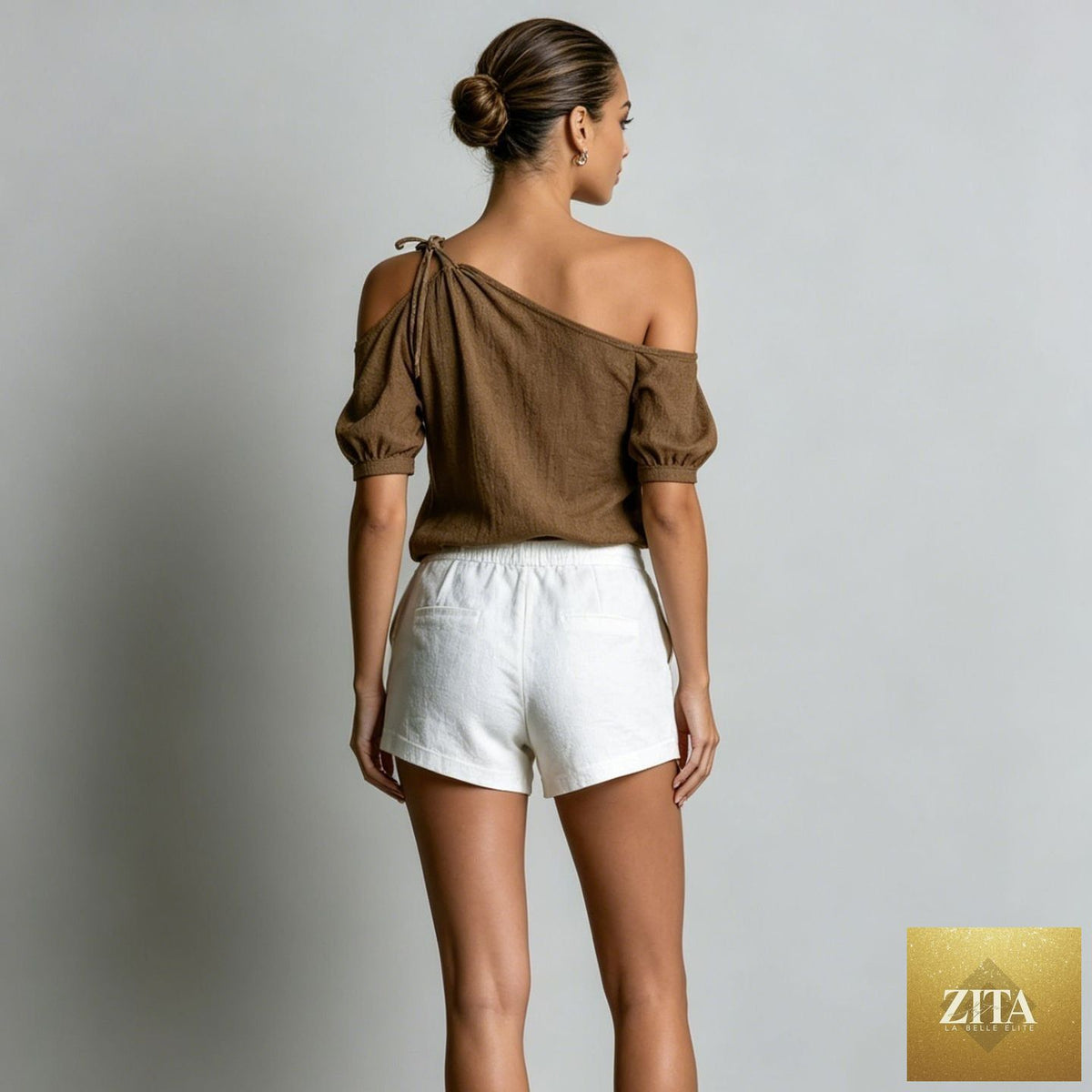 Zita La Belle Elite off-shoulder short-sleeve casual top in various colors, XS to 3XL, displayed on a hanger.