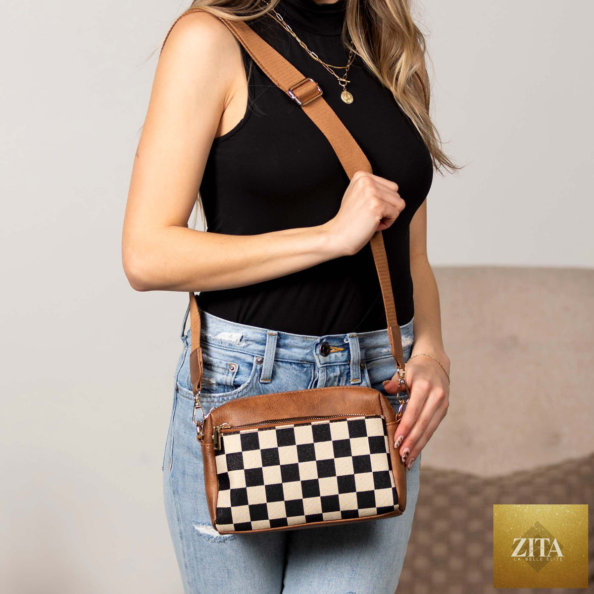 Aili's Corner Jessie mixed media camera crossbody bag with adjustable strap and multiple compartments, canvas and leather design.