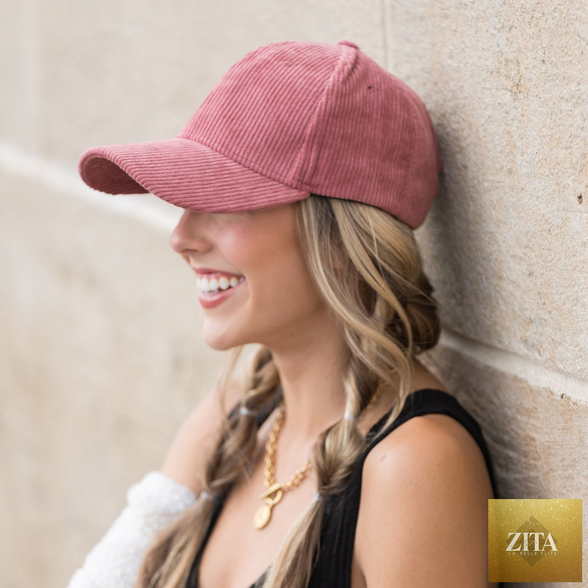A black corduroy boyfriend ball cap with curved brim and adjustable strap, featuring a relaxed, casual style.