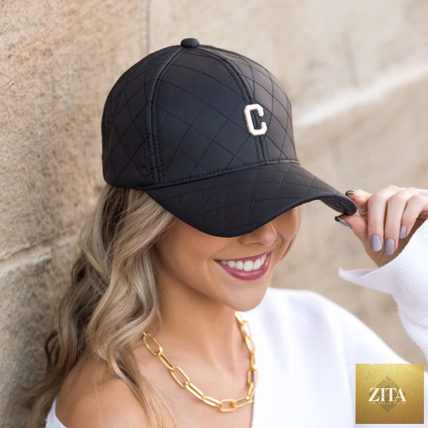 Aili's Corner quilted puffer baseball cap in neutral tones, featuring a rounded crown and curved brim for casual style.