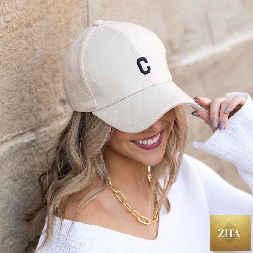 Aili's Corner quilted puffer baseball cap with a rounded brim and padded quilted design, stylish and insulated for casual wear.