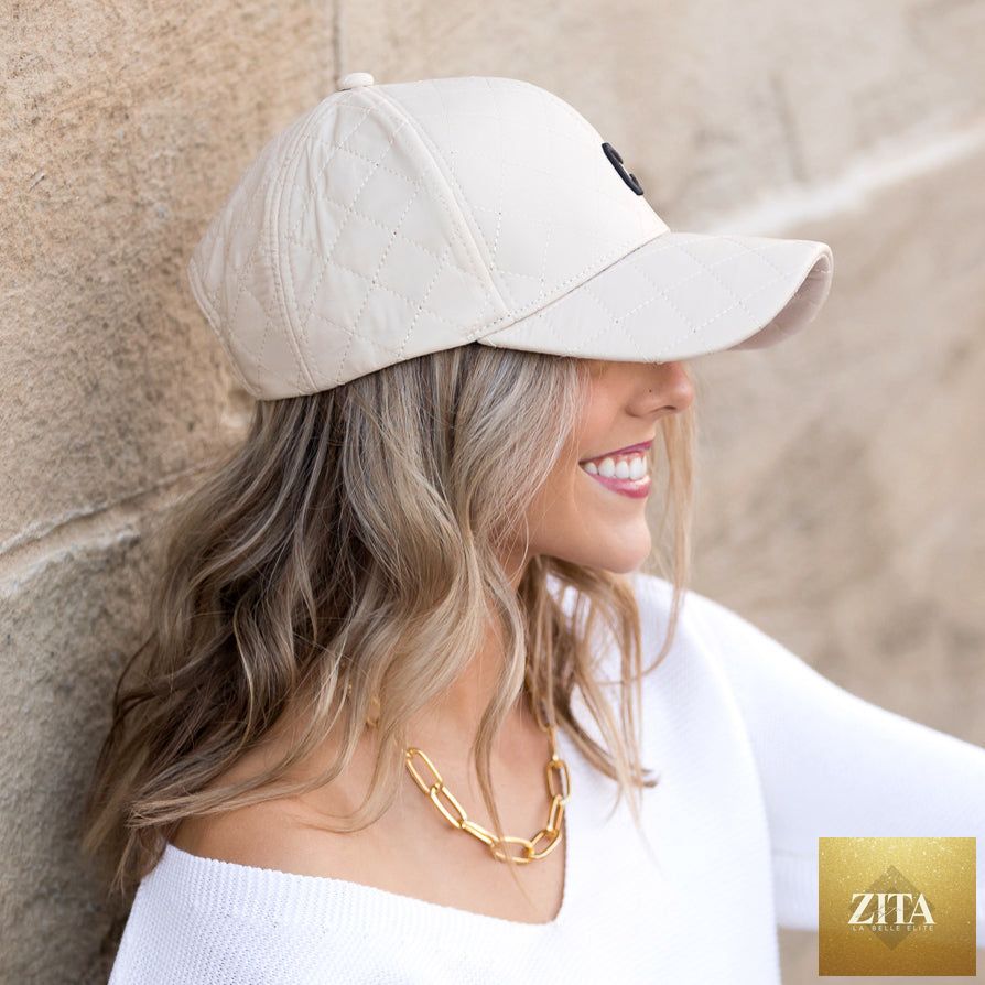 Aili's Corner quilted puffer ball cap, a stylish baseball cap with a quilted puffer design and adjustable strap.