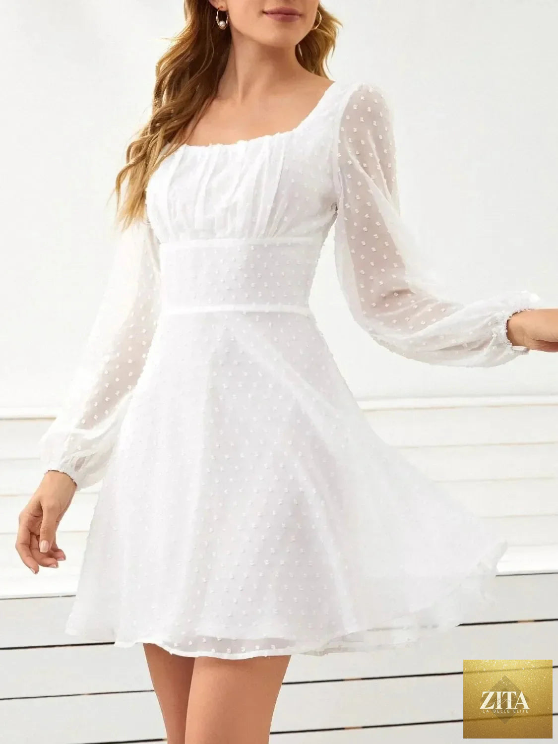 Swiss Dot long sleeve mini dress by Shopiebay featuring a classic pattern and elegant fit, perfect for casual or dressy occasions.