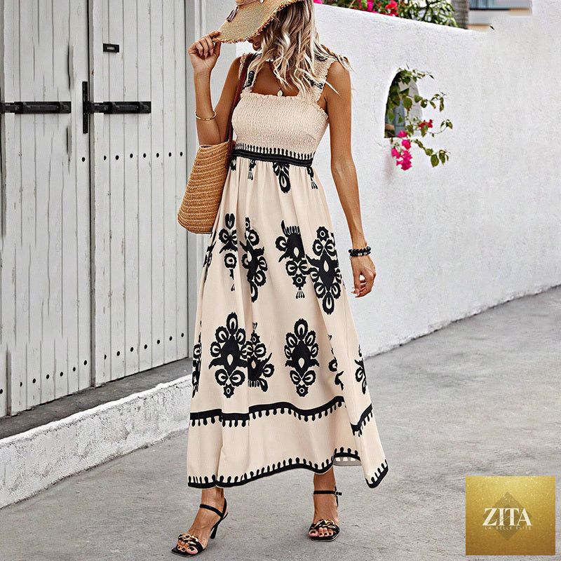 Women's wide-strap printed maxi dress by MERIDGE featuring a smocked bodice and tassel waist, flowing fabric and vibrant pattern.
