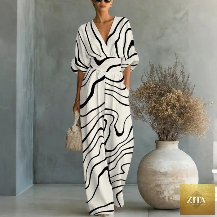 Women's waist-cinched V-neck printed wide-leg jumpsuit by Zita La Belle Elite, featuring a casual, stylish design.