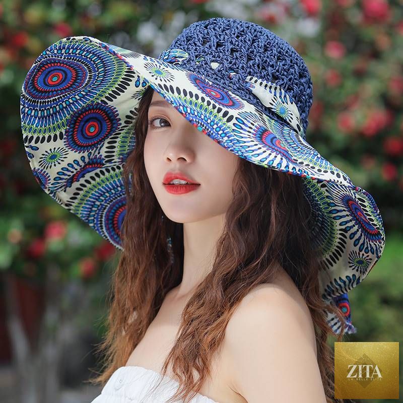 Women's patterned straw beach sun hat with round crown from Zita La Belle Elite, offers UV protection for summer outdoor wear.