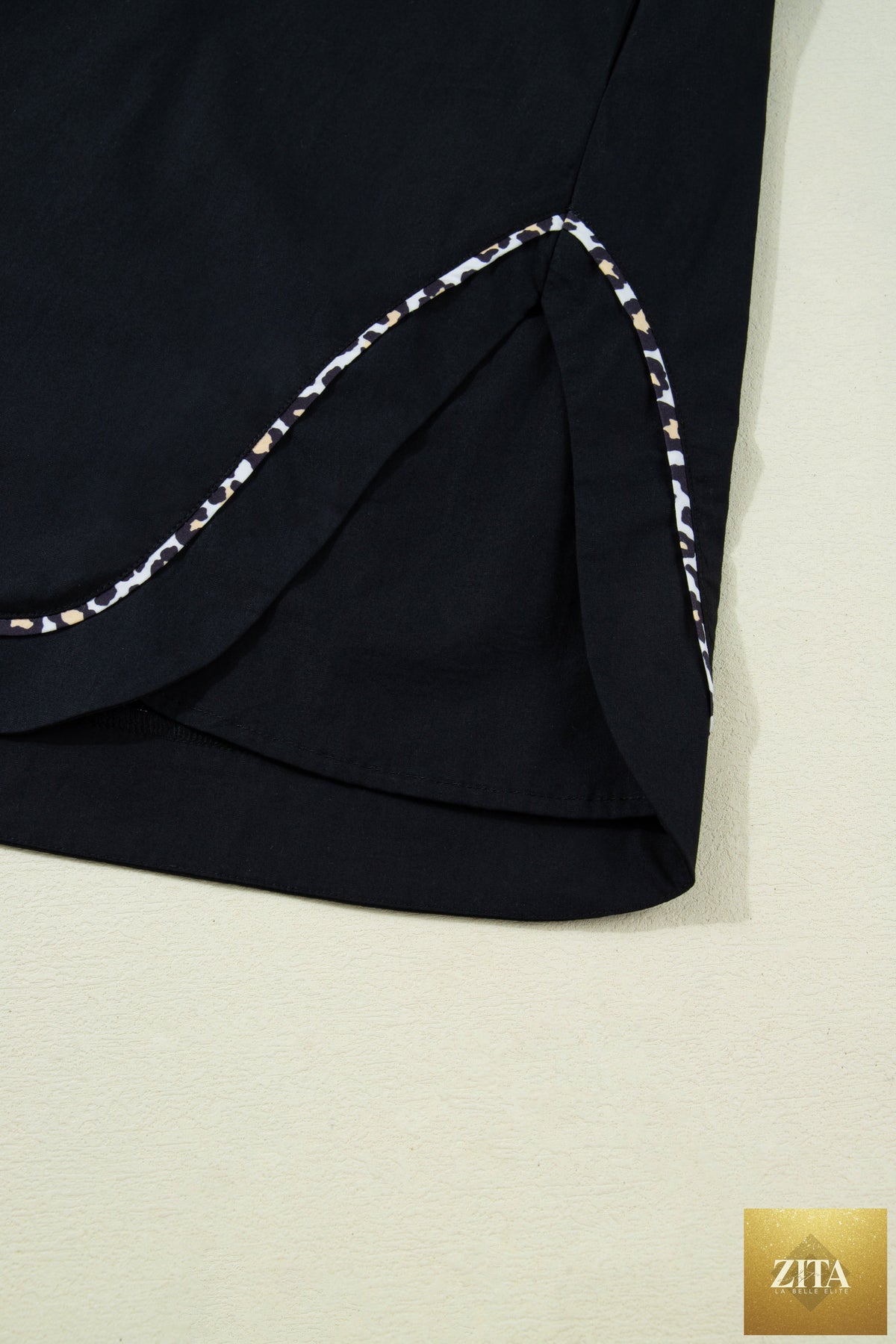 Black leopard trim notched neck mini dress with short puff sleeves, stylish shift silhouette from Wild and Free Boutique.