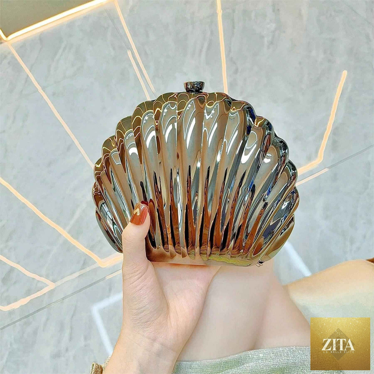 Elegant women's seashell acrylic clutch by SHOMICOBOUTIQUE featuring metallic finish, perfect for parties and evening events
