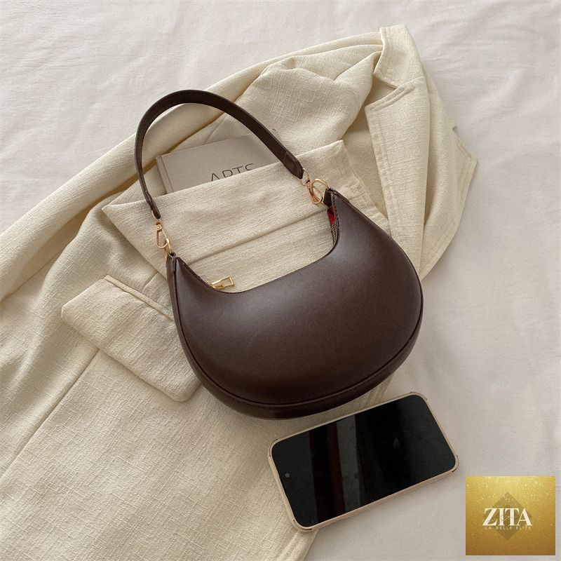 Textured shoulder bag for women, Niche Crescent New Simple All-Match by Social Buzz eSIMs, featuring a stylish, versatile design.