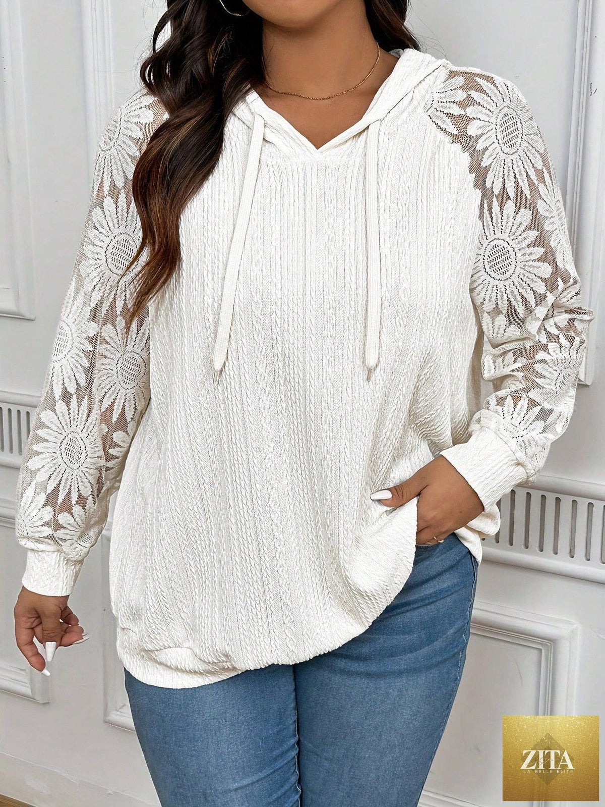 White women's long sleeve hoodie with round neck and lace paneling, featuring hollow-out details from Zita La Belle Elite.