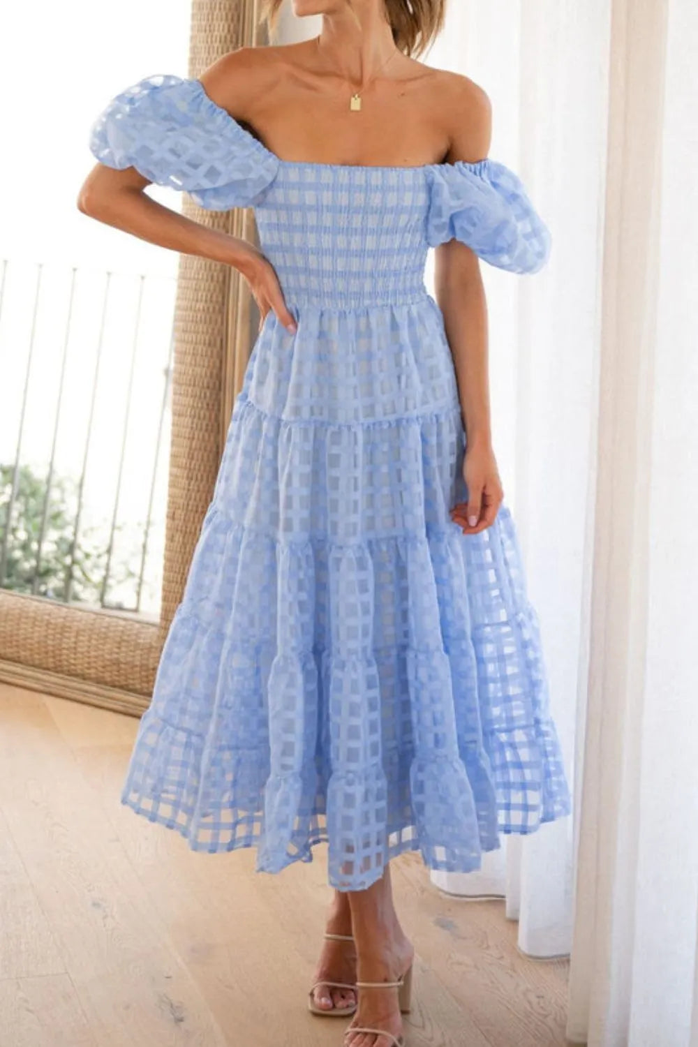 Off shoulder short puff sleeve midi dress by Shopiebay, featuring a feminine design with a fitted waist and flowy skirt.