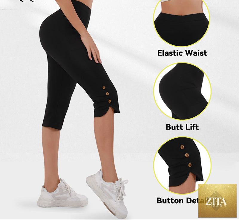 Black women's high-waisted slim fit Capri pants with slit hems from FitiqueFit, shown on a model.