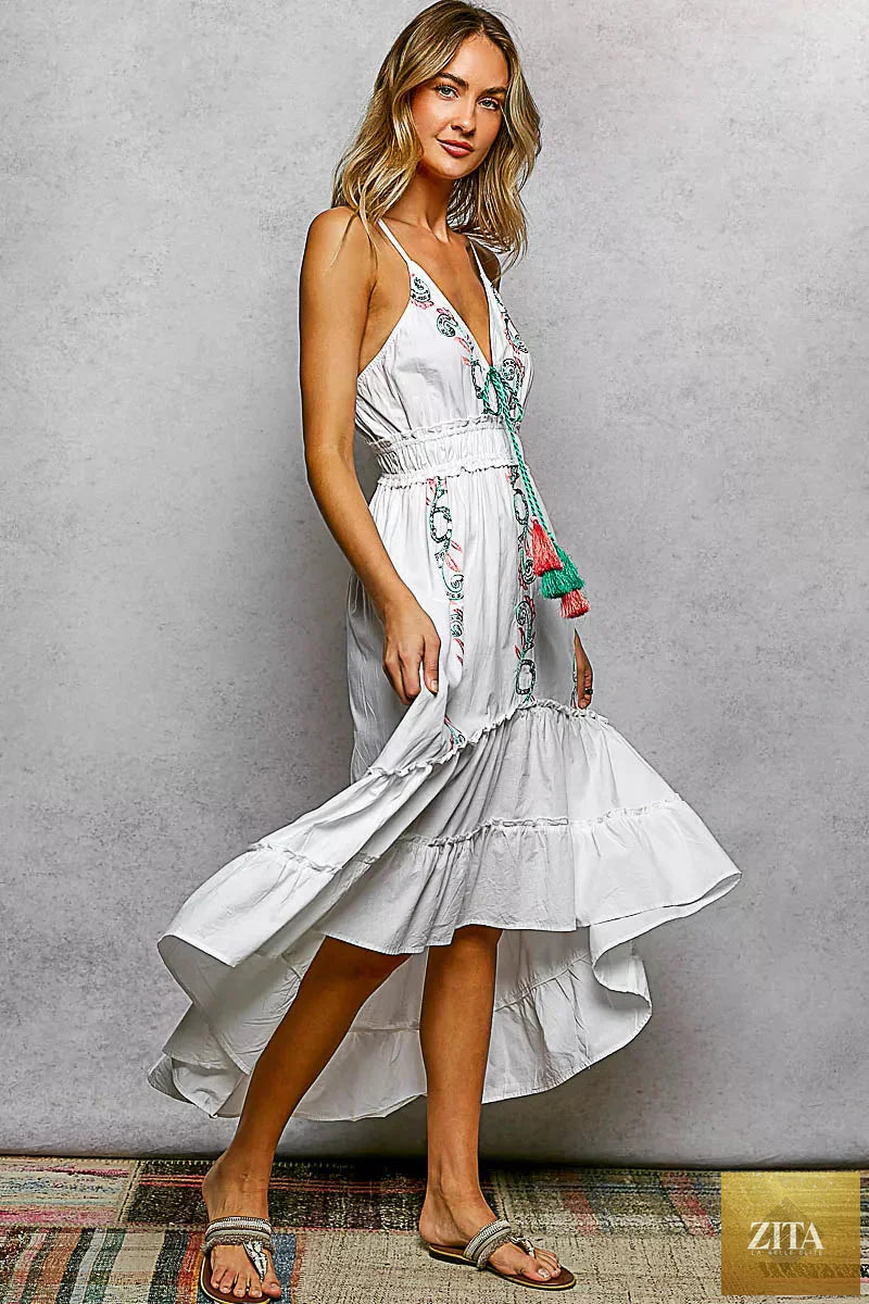 Blu Lotus Boutique embroidered detail tassel tie smocked waist midi tiered cami dress with floral embroidery and flowy fabric.