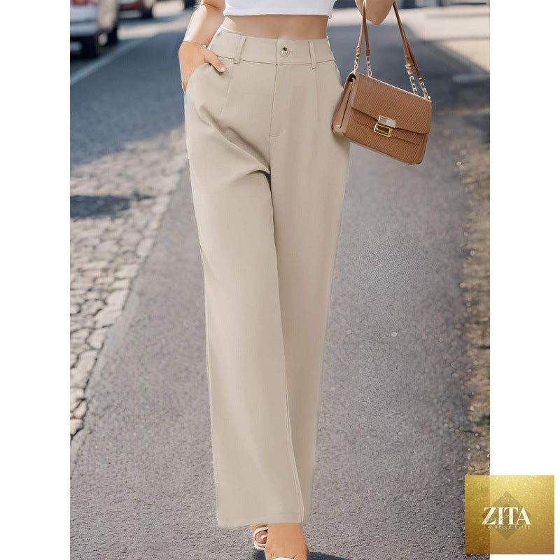 Elegant women's suit pants with pockets, tailored fit, in a professional style, perfect for business or formal occasions.