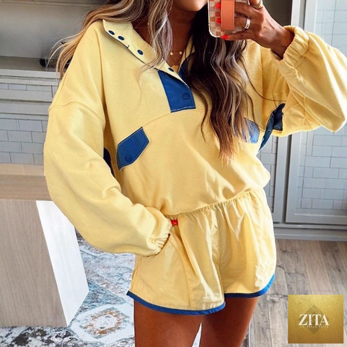 Women's casualwear long-sleeve contrast color 2-piece set with top and cropped pants by FitiqueFit, displayed on a hanger.