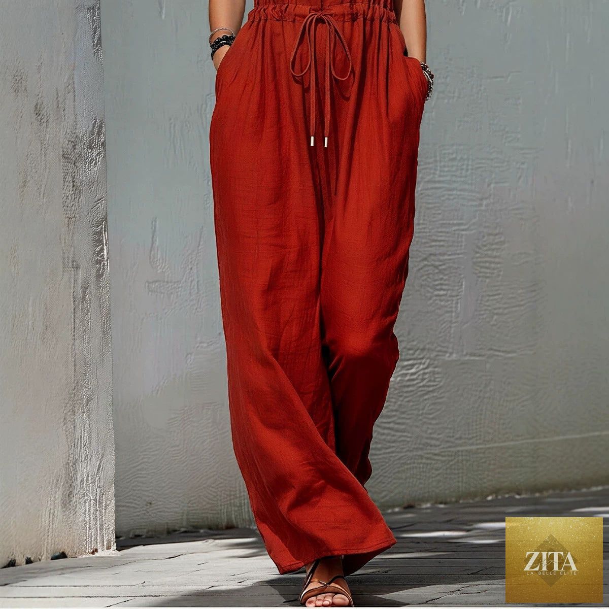 Women's sleeveless halter neck long jumpsuit by Zita La Belle Elite, solid color casualwear with a fitted silhouette.