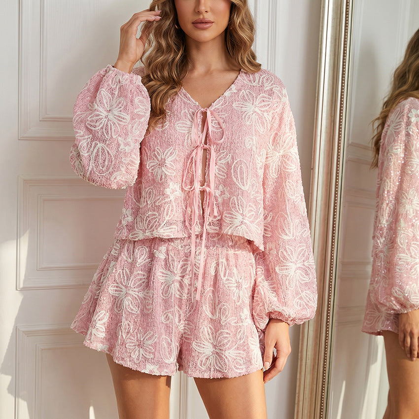 FitiqueFit v-neck long sleeve lace-up top and matching shorts two-piece set, stylish casual outfit, close-up view of fabric and design.