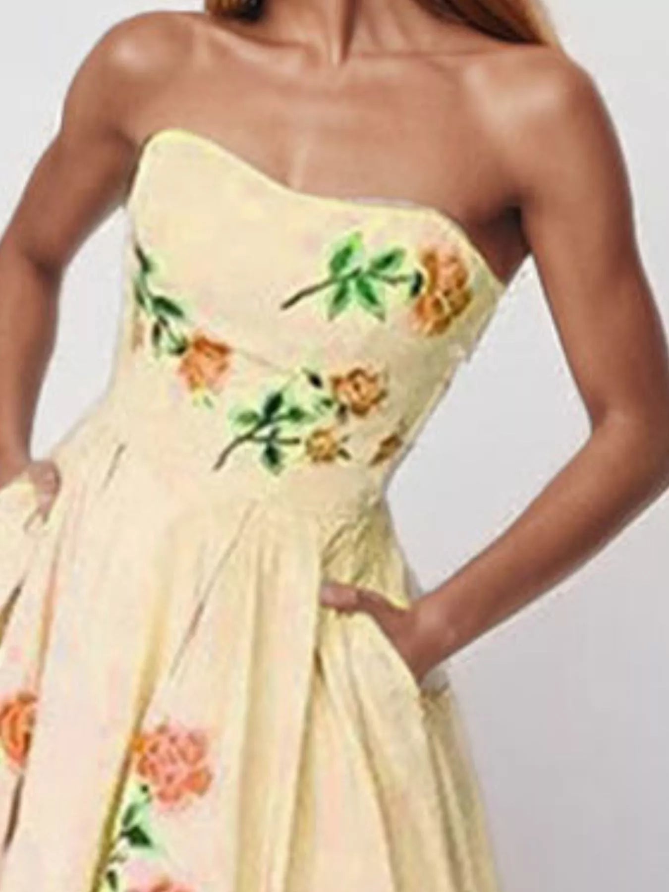 Floral print tube maxi dress by Shopiebay featuring a fitted bodice and flowing skirt with vibrant flower patterns.