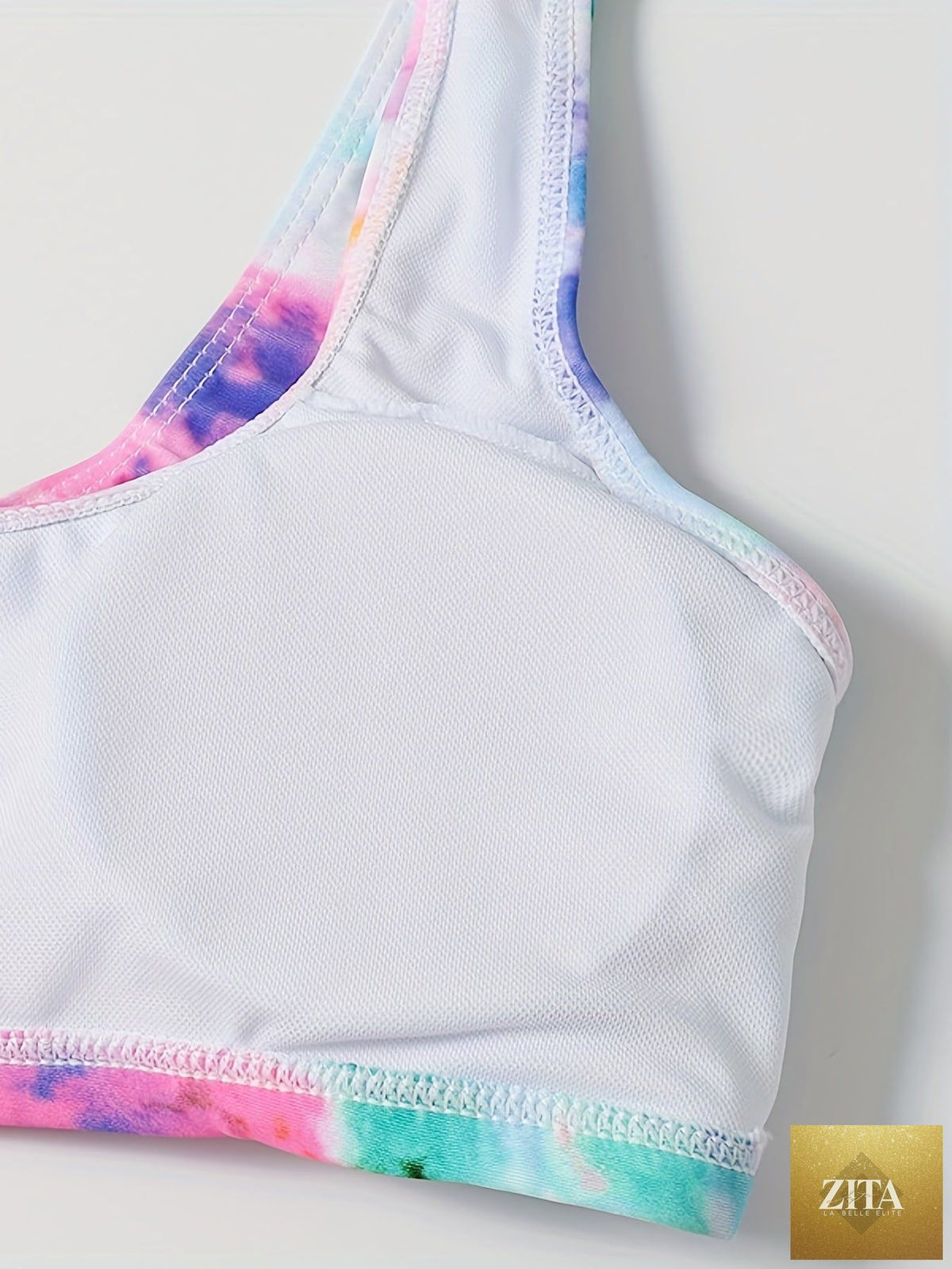 Stevvex tie-dye bikini set featuring high waist, round neck crop top, and high-cut leg for stylish summer beachwear.