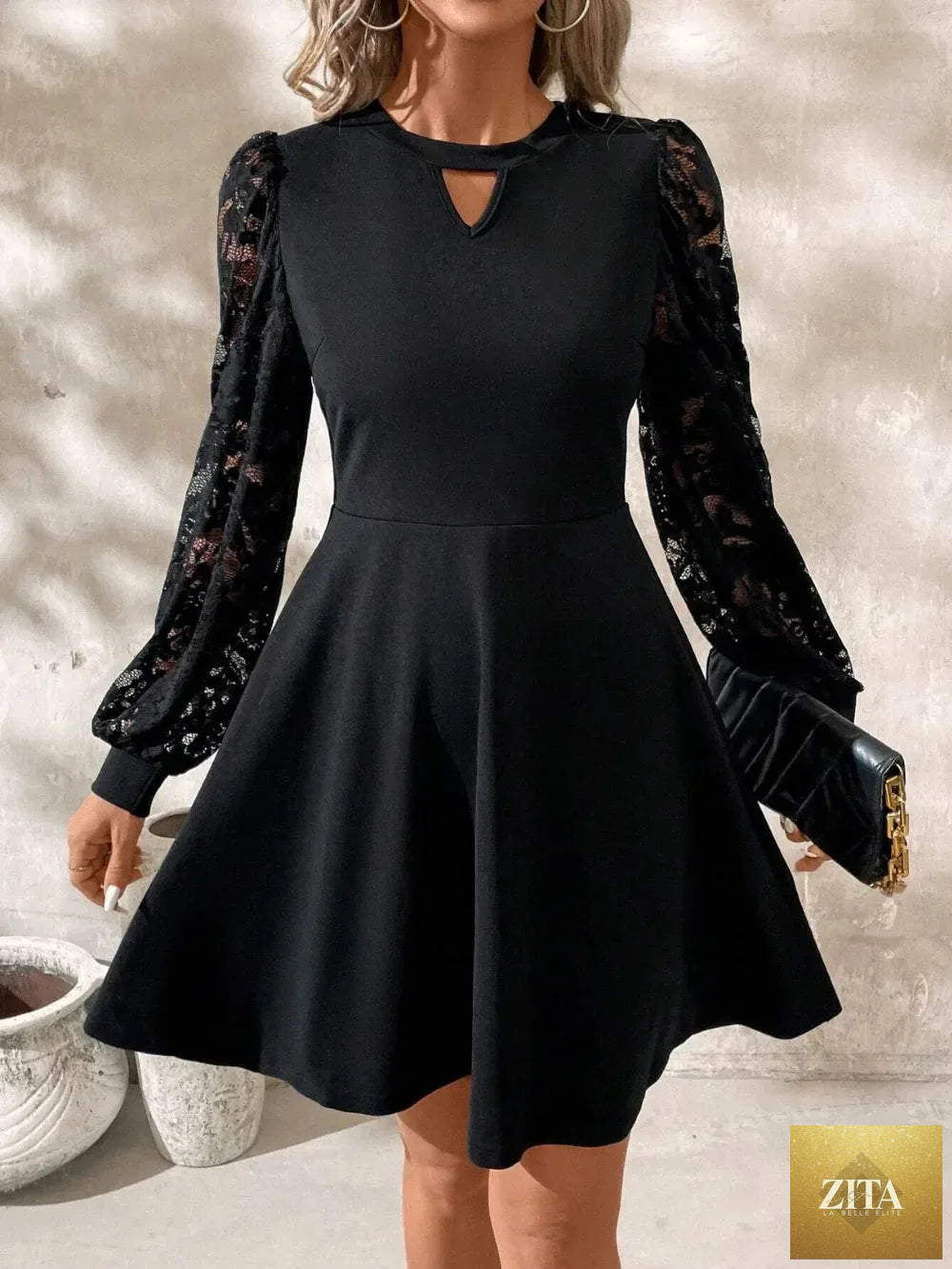 Shopiebay cutout lace long sleeve mini dress featuring a fitted silhouette and intricate lace detailing.