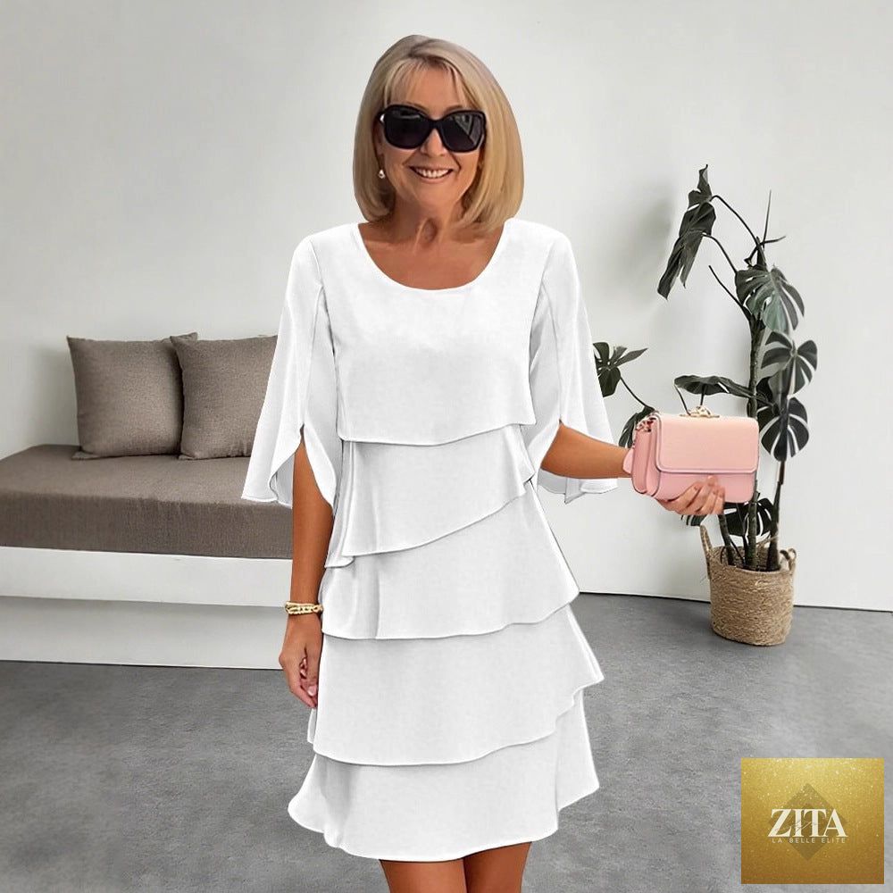 FitiqueFit patchwork cake midi dress with round neck, short sleeves, and tiered skirt, featuring colorful patchwork design.