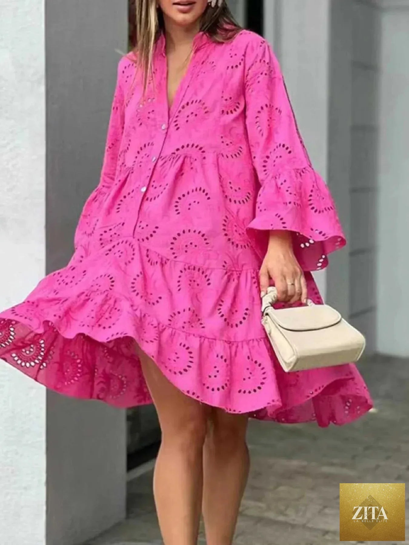 Eyelet ruffled hem tiered dress by Shopiebay featuring a flowy, layered design with eyelet detailing and ruffled accents.
