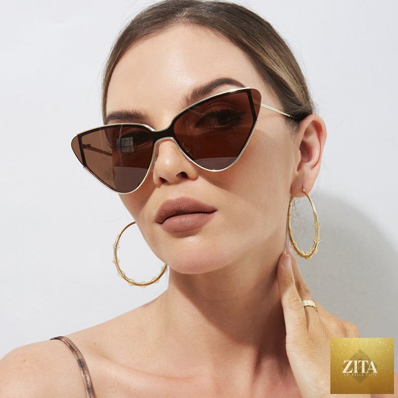 Retro cat-eye sunglasses by FitiqueFit featuring vintage-inspired stylish shades with bold black frames and tinted lenses.