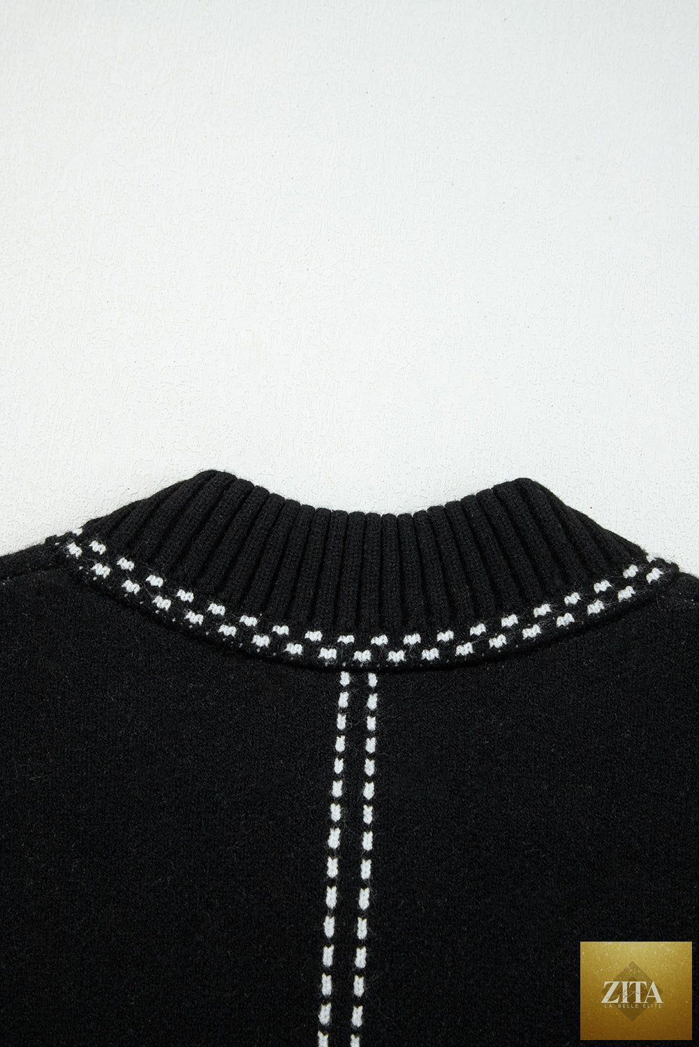 Black contrast trim button-up sweater cardigan from Wild and Free Boutique, featuring a classic design with button closure.