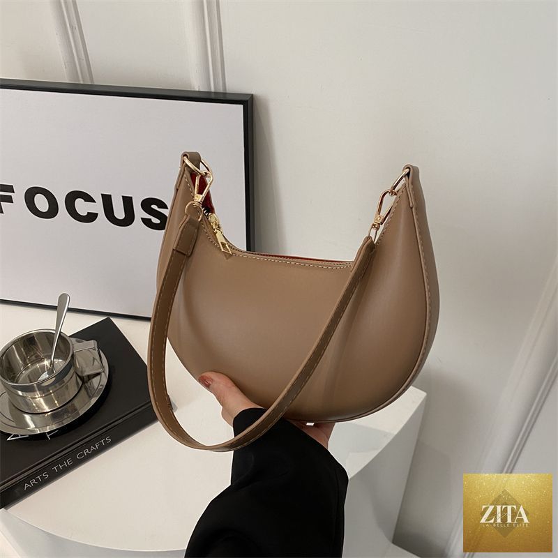 Textured shoulder bag for women by Social Buzz eSIMs, featuring a simple, versatile design perfect for everyday use.
